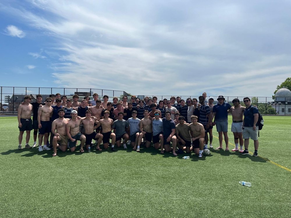 GURFC alumni and current players together on the pitch at Alumni Weekend