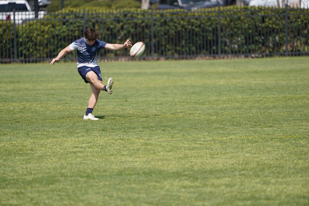 A GURFC player striking a clearing kick