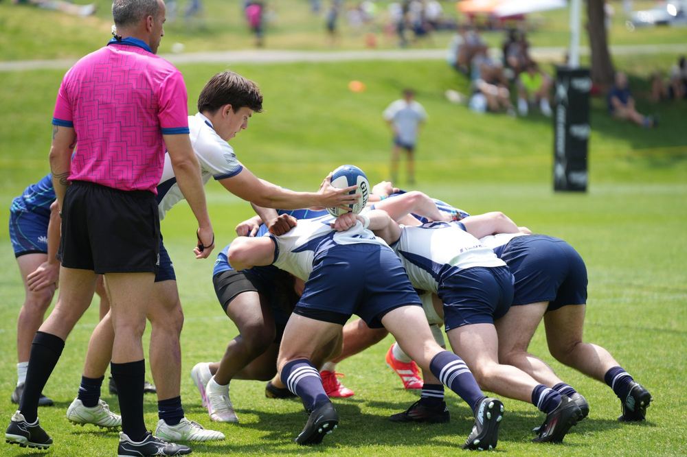 A GURFC scrumhalf feeding the ball into a scrum